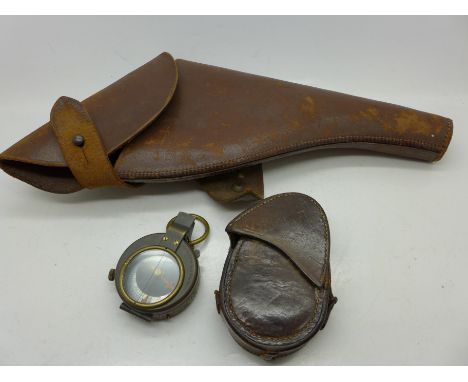 A leather pistol holster and a WWI Verner's Pattern VII compass with leather case (2)