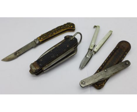 Three pocket knives, one marked Harrison Bros. &amp; Howson and a pair of folding scissors