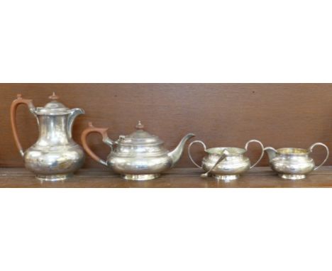 A four piece silver tea service by Walker &amp; Hall, and a pair of silver sugar bows, service hallmarked Sheffield 1922, 167
