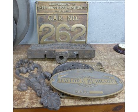 Five metal name plaques including Brooks &amp; Doxey and Royce, and a finial plaque
