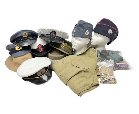 WWII Army shirt dated 1943; ten various hats, caps and sidecaps; quantity of cloth badges and ties; group of three WWII medal