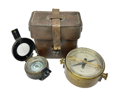 WWII British marching compass, the black lacquered brass case inscribed T.G.Co.Ltd. No.B100228 (broad arrow) 1941 Mk.III; and