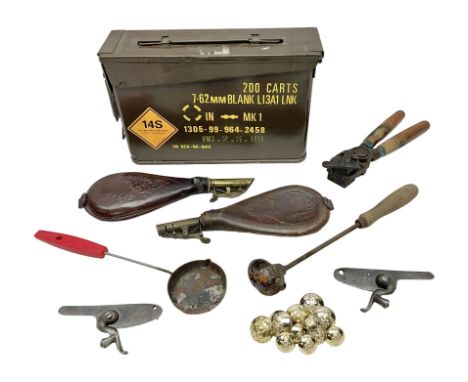 Two leather shot flasks with embossed decoration and brass nozzles; scissor action bullet mould with two ladles; pair of 19th