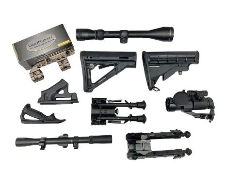 Assorted shooting accessories including two telescopic sights, red dot sight,  two bi-pods, spirit level mount, two gun butts