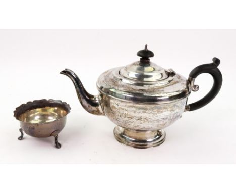 A George III style circular silver teapot, Birmingham 1931, makers mark rubbed, with blackwood scroll handle and finial to th