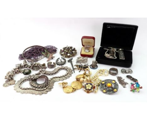 A collection of mostly silver jewellery to include; an Indian white metal fringe panel necklace, an Indian cabochon garnet an