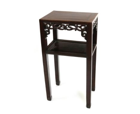 A Chinese rosewood rectangular two tier stand, second half 19th century, with scroll pierced friezes, on moulded square legs,