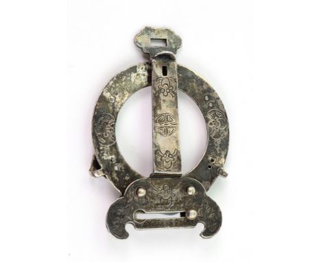 A Chinese buckle, 19th century, of shaped outline with circular centre, engraved with mons, seal, scroll, foliate and other m