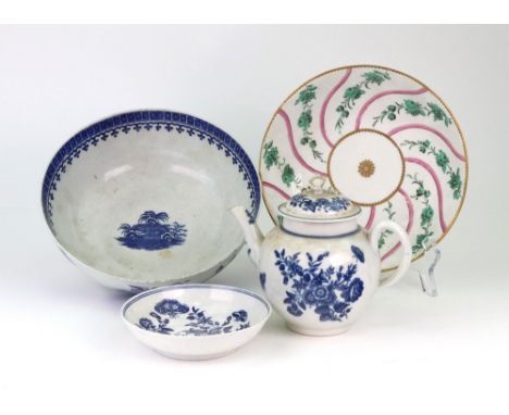 A group of Worcester blue and white porcelain, circa 1775, comprising: a bullet shaped teapot and matched cover and a saucer 