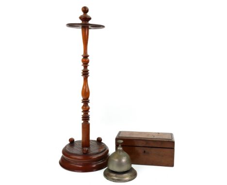 A Victorian walnut stick stand, the circular top with three divisions, on a ring and baluster turned pillar, on a socle, 56cm