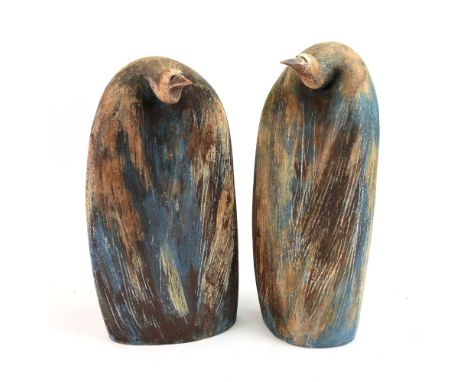 A pair of contemporary ceramic sculptures of penguins, with impressed mark 'J B' to base, 38cm high, (2).