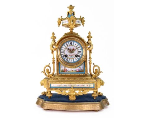 Bennett, 65 & 64 Cheapside London:  A Louis XVI style gilt metal mantel clock, circa 1880, with circular porcelain dial paint