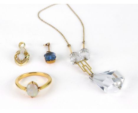 A gold and cabochon opal ring, size N, 3.7g gross, a gold and rock crystal pendant necklace of Art Deco design, with faceted 