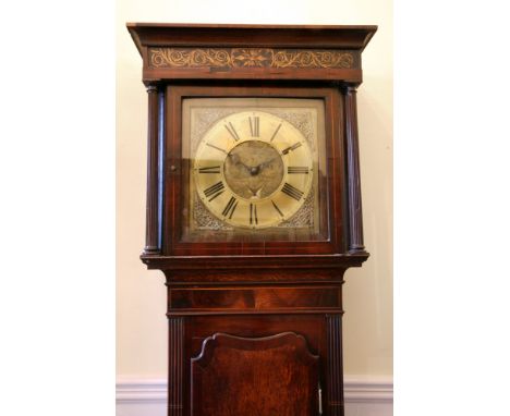 A George III oak mahogany and boxwood strung longcase clock, the square hood with a gilt leafy scrollwork and foliate painted