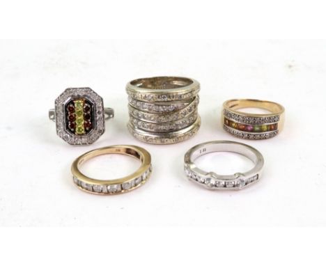 A group of five rings; a white gold and 11-stone brilliant-cut gem set ring stamped 585, size O, 3.5g gross, a white gold and