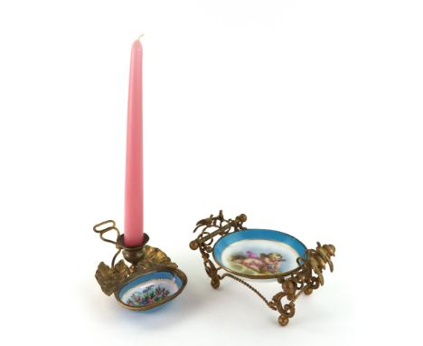 A French gilt metal mounted circular porcelain dish, in Sevres style, circa 1880, painted with a cherub, the beaded and leaf 