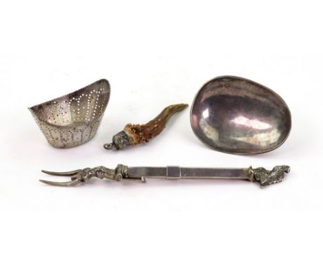 A Dutch silver navette shape strainer, 19th century, the base and sloping sides pierced with dots, 6cm wide, the bowl of a Du