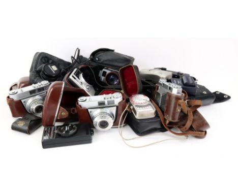 A Kodak Retina II camera, and two Kodak Retinette IA cameras in leather carrying cases, and a collection of various other cam