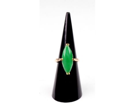 A yellow metal and cabochon jade ring, the marquise shaped cabochon approx. 23 x 8.3mm, size M, 2.6g gross.