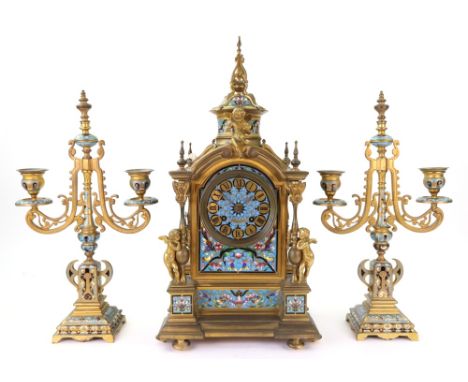 Japy Freres; a French gilt metal and champleve enamel mantel clock, circa 1870, of architectural style, the domed top case su