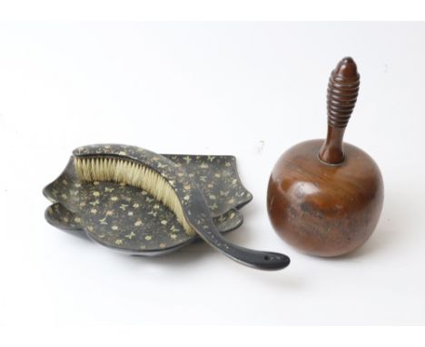 A papier mache crumb tray and brush, first half 19th century, butterfly and flowering branch decorated on a black ground, 26c