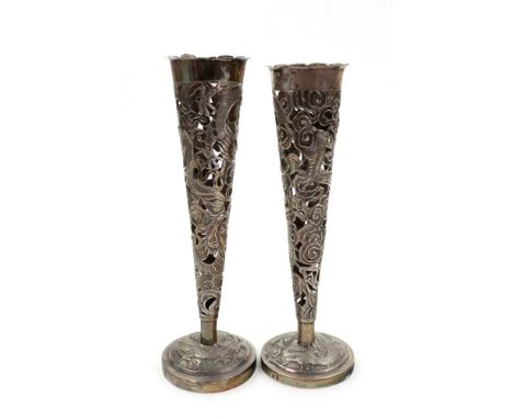 A pair of Chinese silver vases, Wang Hing & Co, late 19th/early 20th century, of trumpet shape pierced and embossed with drag