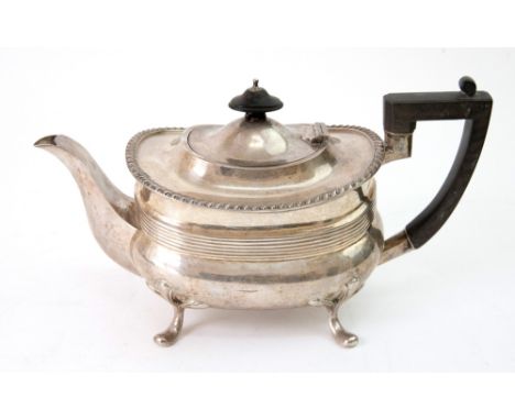 A Regency style silver teapot, Joseph Rodgers & Sons, Sheffield 1920, rounded oblong with gadroon border, threaded girdle, on