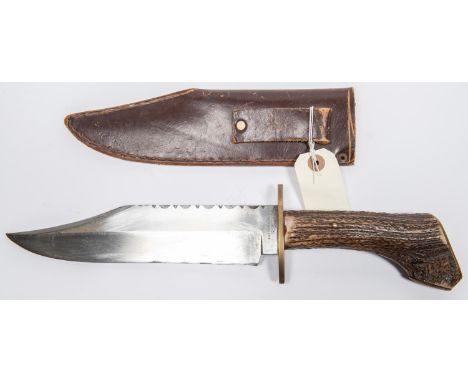 A Bowie Knife with clipped back blade 9", marked "R and R Middleton Sheffield", staghorn hilt with brass cross piece, in its 