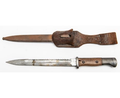 A German M1884/98 bayonet, saw back blade 10" with incomplete Solingen maker's name, the hilt with plain wood grips and flash