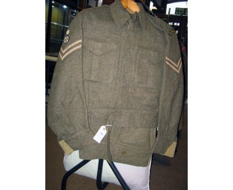 A good WWII Canadian issue BD suit with K.S.L.I. insignia, comprising khaki BD blouse with Corporals stripes and drivers arm 