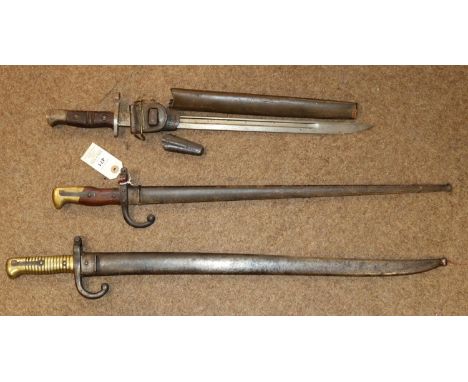 A Gras bayonet, dated 1877; a Chassepot bayonet, both in scabbards (Chassepot seized); also a P17 bayonet, scabbard AF. £50-6