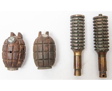 A WWI Mills Bomb, lever missing, another similar drill type, lever missing, the main body sections of 2 rifle grenades. GC Pl