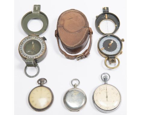 A WWI British Army compass, dated 1915, in its leather belt pouch; another painted olive drab; another dated 1918; a pocket w