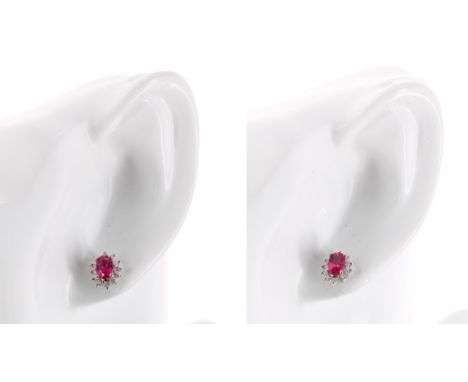 Pair of 9ct white gold ruby and diamond oval cluster earrings, 1.7gm, 10mm x 7.5mm