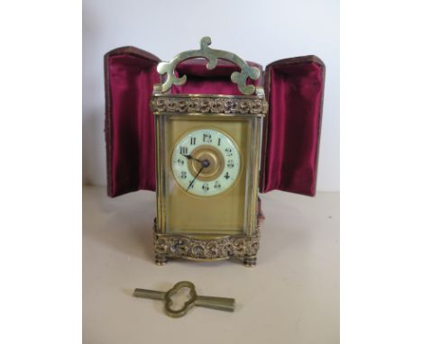 A 19th Century carriage clock c1890 in a douchine case with key - in good condition and in working order - 15cm high 