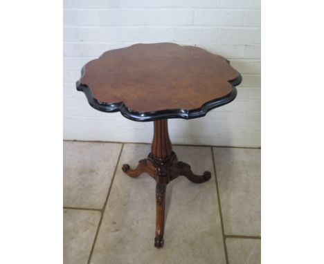 A good 19th Century walnut side table with a shaped top on a carved tripod base - in good clean restored condition - 74cm tal