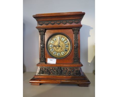 A small oak case mantle clock, brass dial - 29cm tall 