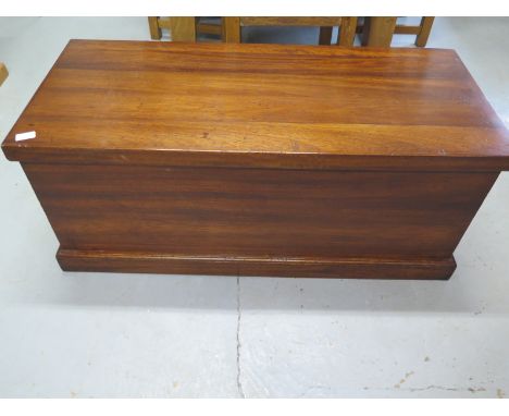 A Mahogany storage trunk with a lift up lid - in very good condition - 107cm wide x 45cm high x 46cm deep 