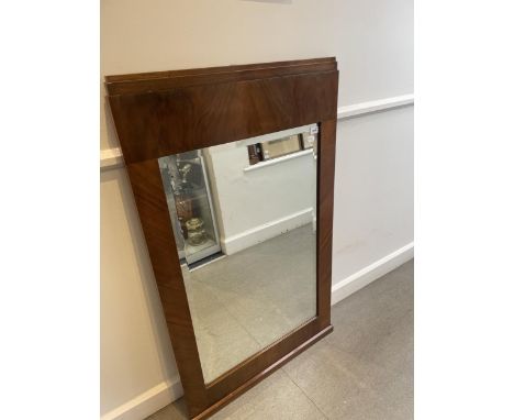 An Art Deco wall mirror, in a walnut frame, 123 x 75 cm 