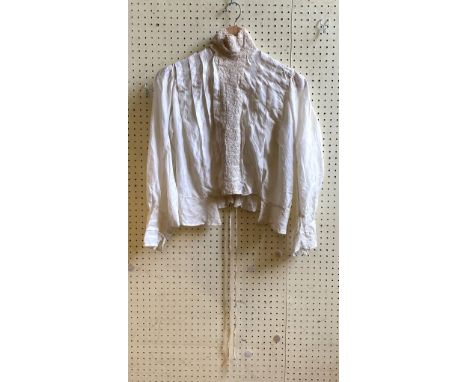 A late 19th century/early 20th century blouse, with a lace collar and trim 