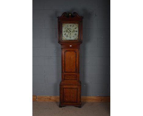 A Victorian longcase clock, with a scroll pediment and a brass finial, with a painted white dial with Roman numerals and flor