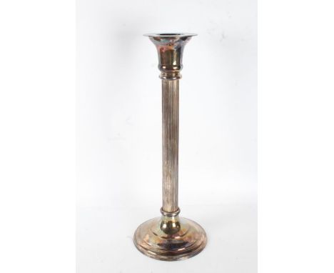 A very large and impressive silver plated candlestick, with a flared neck above a reeded stem, 64cm high&nbsp;