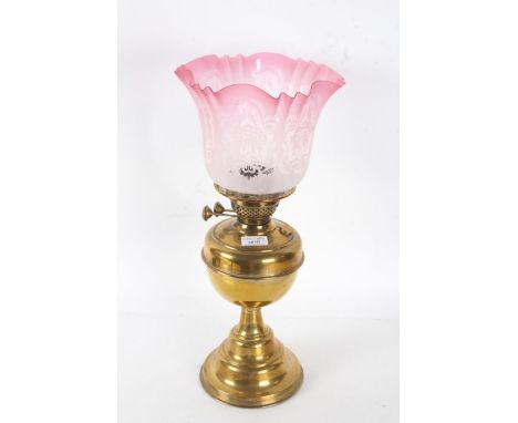 Duplex brass oil lamp, with frosted and cranberry etched glass shade