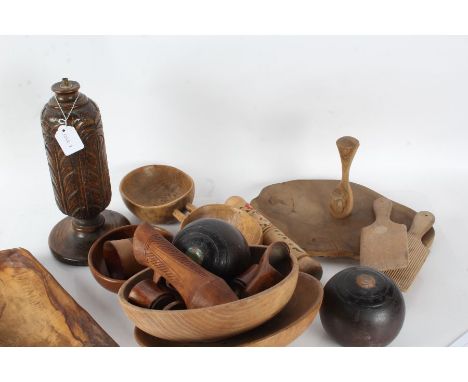 Collection of treen, to include butter pats, bowls, chopping board, table lamp base, two bowling woods etc., (qty)