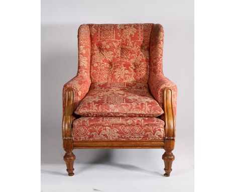 19th Century oak armchair, of large proportions, the button back with wing sides above a cushion seat and oak fronted sweepin