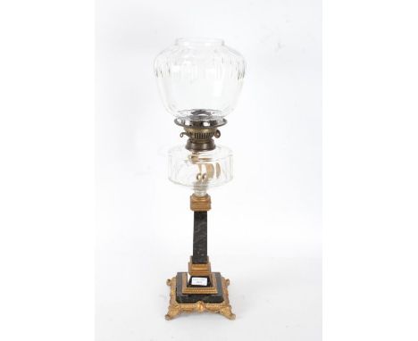 A Victorian oil lamp, with a ormolu and marble base and stem with a clear glass reservoir and shade, 62cm high&nbsp;&nbsp;