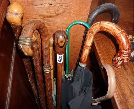 Walking sticks and umbrellas inc. walnut stick with entwined brass snakes etc. (10)