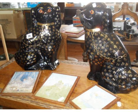 Pair of large black glazed Staffs dogs, with gold enamel decoration (one A/F), and three small Margaret Tarrant fairy prints
