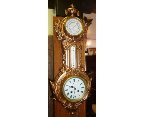 Victorian clock barometer in ornate cast iron frame and six barometers/thermometers