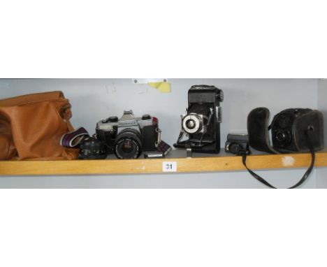 Praktika PM3 slr camera with two lenses, a Kershan King Penguin bellows camera, and an Ensign Ful-Vue camera